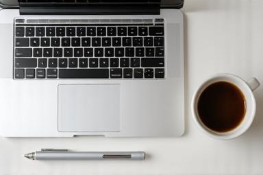 Thumbnail image for a business English resource showing a laptop and coffee.